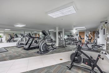 A spacious gym with a variety of exercise equipment. at The Summit at Lake Union, Washington, 98109